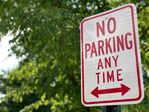 A sign reading "No Parking Any Time"