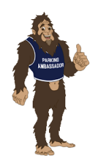 A Sasquatch cartoon with a parking ambassador shirt on 