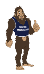 A Sasquatch cartoon with a parking ambassador shirt on
